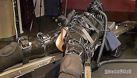 Latex bondage video with a guy holding a big manhood