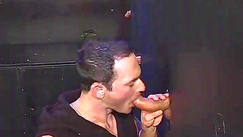 Gloryhole performer is blowing two hard dicks at once