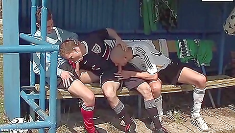 Two footballers and a guy fuck in a deepthroat threeway