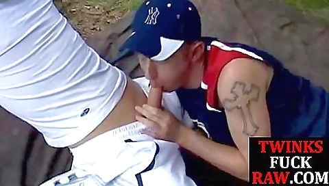 A tattooed woman and a dude have fun together in the backyard