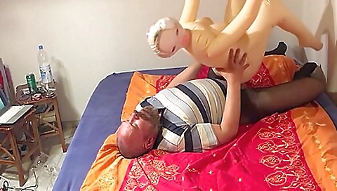 Rubberskin mouth toy and the girl's lips in a threesome