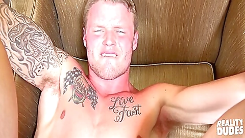 Blonde with a tattoo on her neck is fucking on the sofa