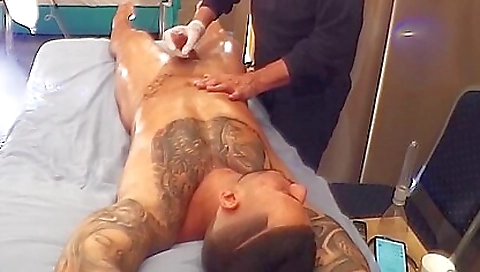 Tattooed dude gets fucked in his pussy during massage
